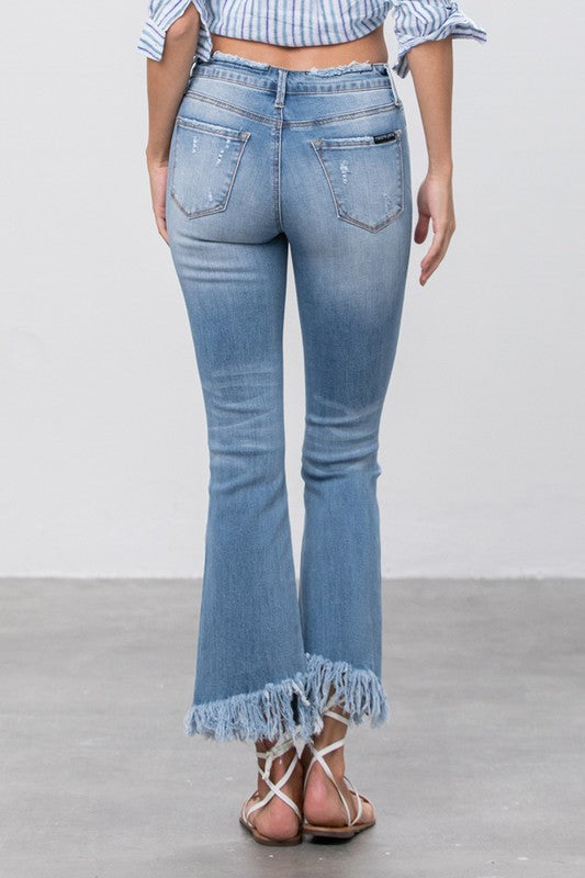 MID RISE LONG BOTTOM FRAYED CROP FLARE